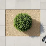 Professionele tuinschaar naast groene struik op beige grind met grijze betontegels, bovenaanzicht tuinonderhoud